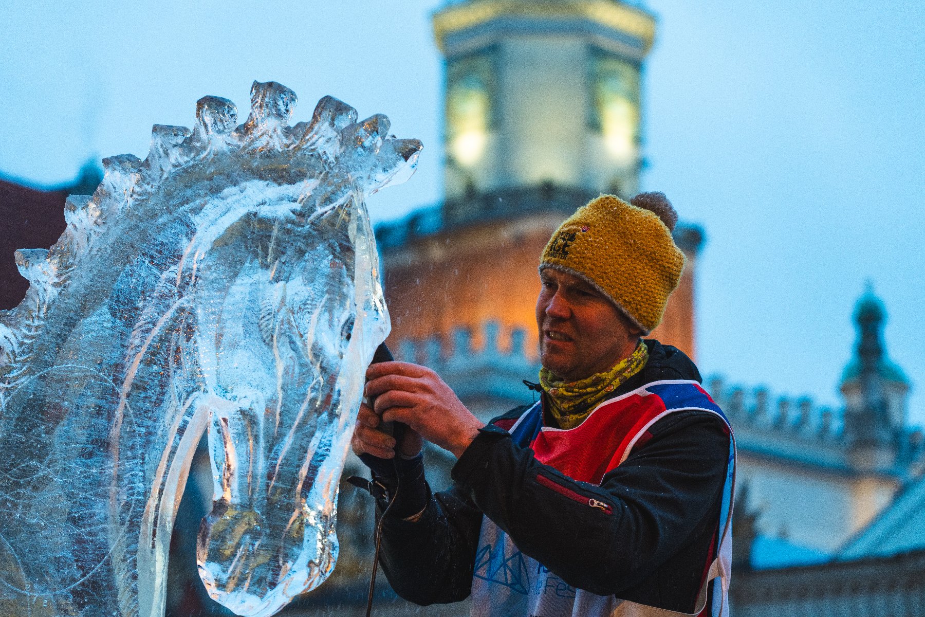 sculptor with the town hall in the background