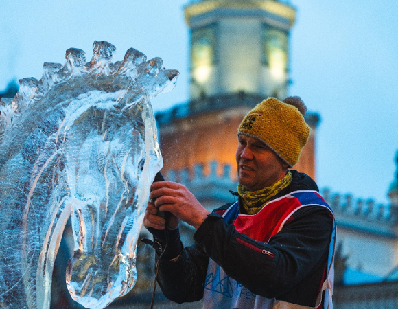 sculptor with the town hall in the background